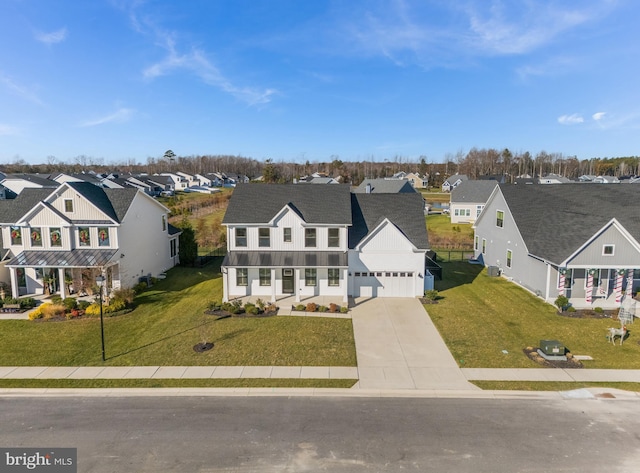 view of front of house with a front yard and a garage