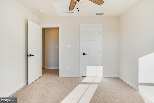 unfurnished bedroom featuring light colored carpet and ceiling fan