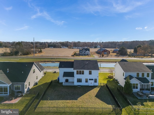 birds eye view of property with a water view