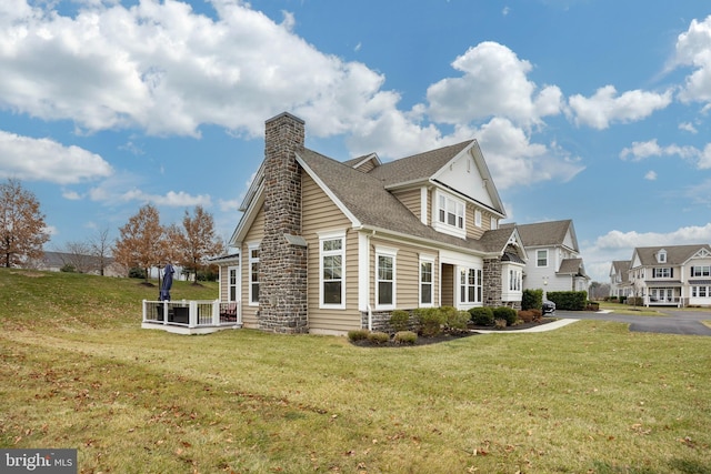 view of side of property featuring a yard