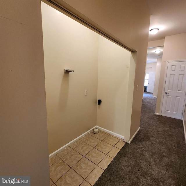 washroom featuring light colored carpet