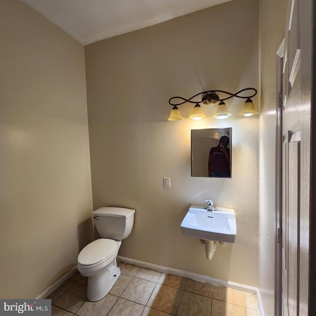 bathroom featuring tile patterned floors, sink, and toilet