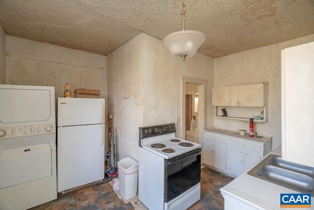 4679 Jeffersonton Rd, Jeffersonton, VA 22724 - kitchen with white appliances, stacked washer / drying machine, a sink, light countertops, and white cabinetry