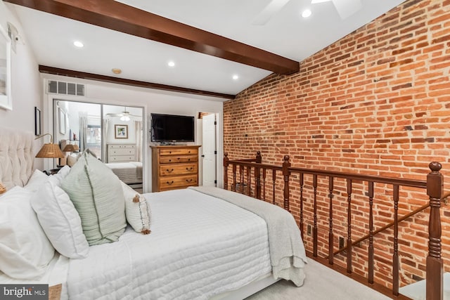 bedroom featuring carpet flooring, vaulted ceiling with beams, ceiling fan, and brick wall