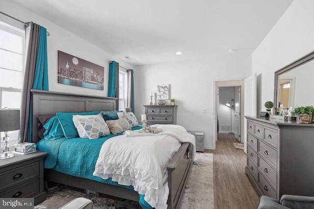 bedroom with light wood-type flooring