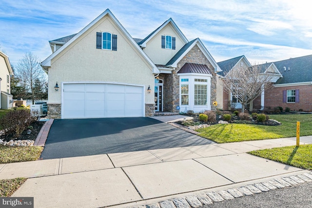 craftsman-style house featuring a garage and a front lawn