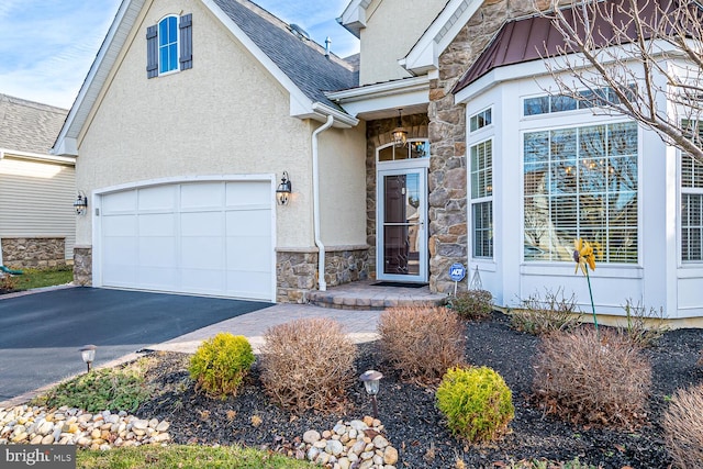 entrance to property featuring a garage