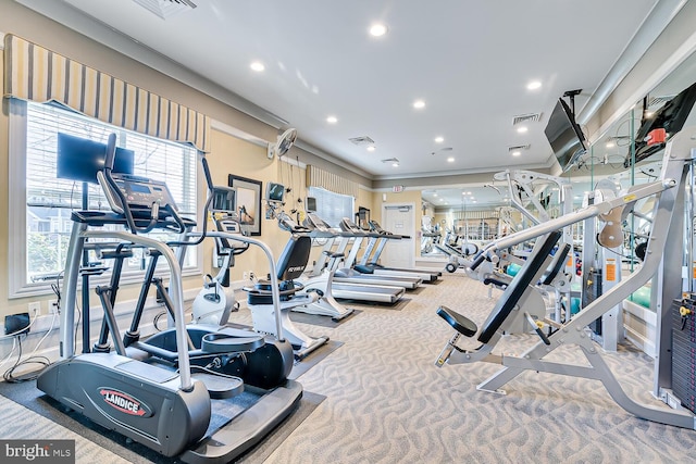 gym featuring carpet floors and crown molding