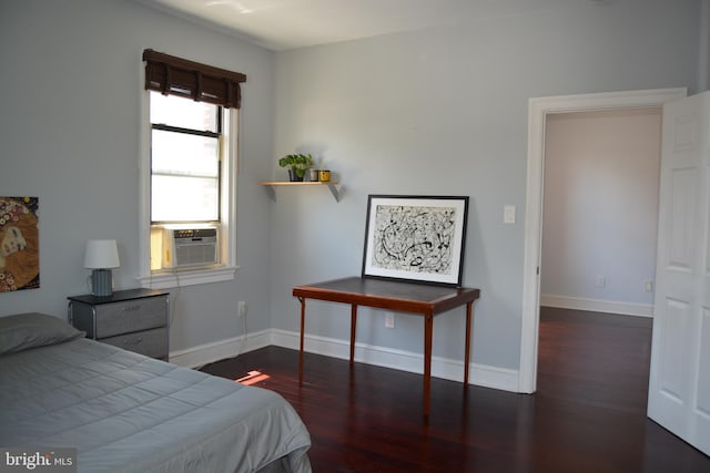 bedroom with dark hardwood / wood-style floors and cooling unit