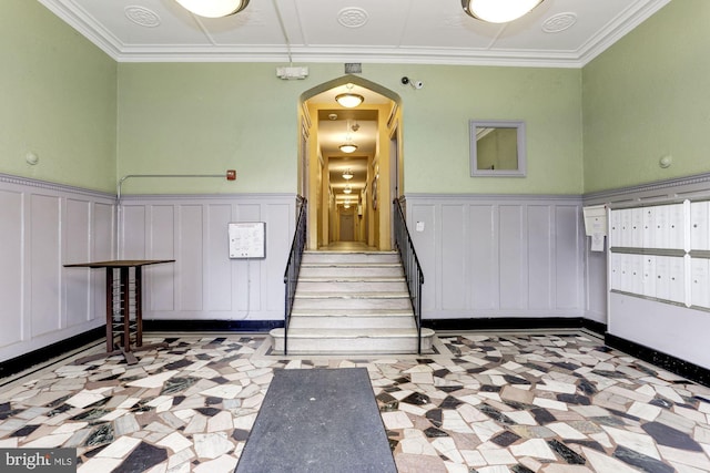 interior space featuring crown molding and a mail area