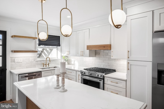 kitchen featuring tasteful backsplash, sink, white cabinets, and appliances with stainless steel finishes