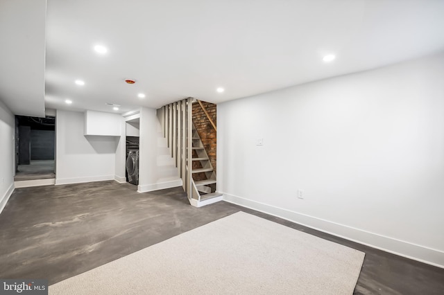 basement with stacked washer / dryer