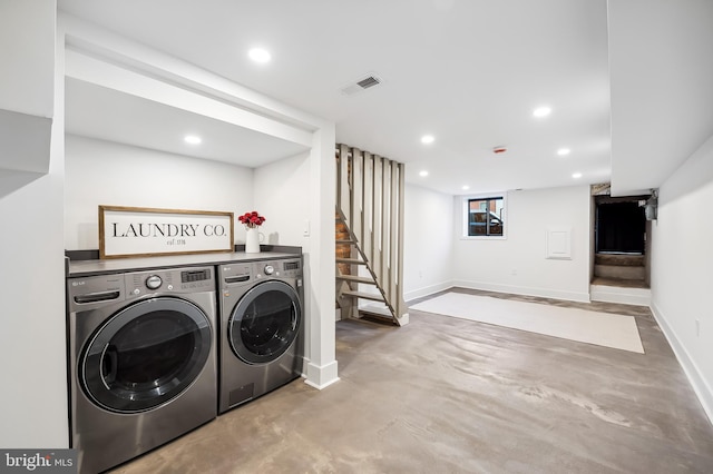 laundry area with washer and clothes dryer