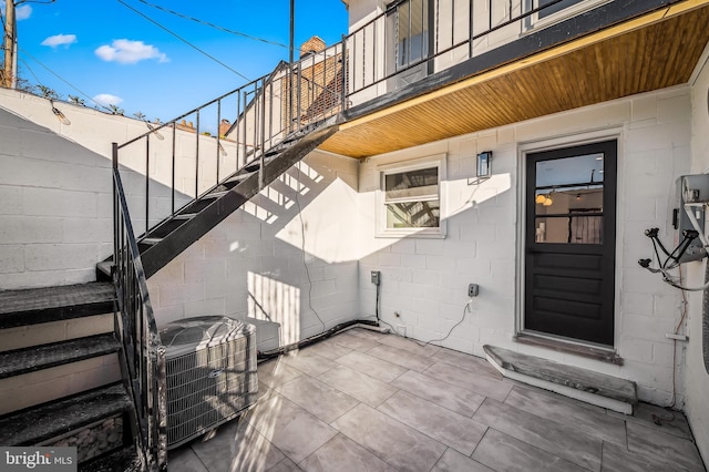 doorway to property featuring central AC unit