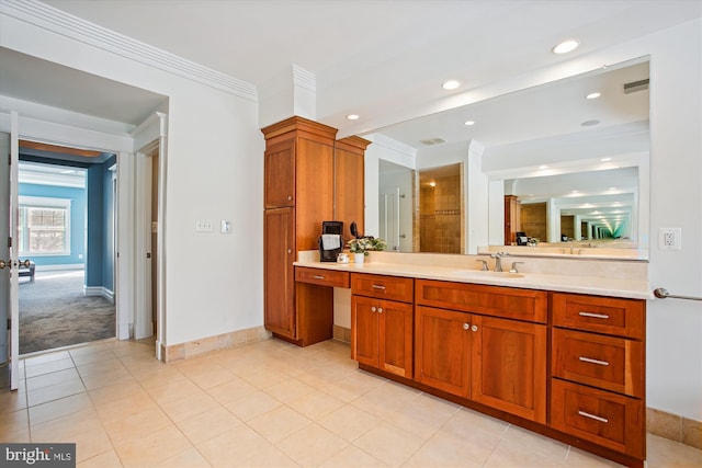 bathroom with vanity, tile patterned floors, walk in shower, and ornamental molding