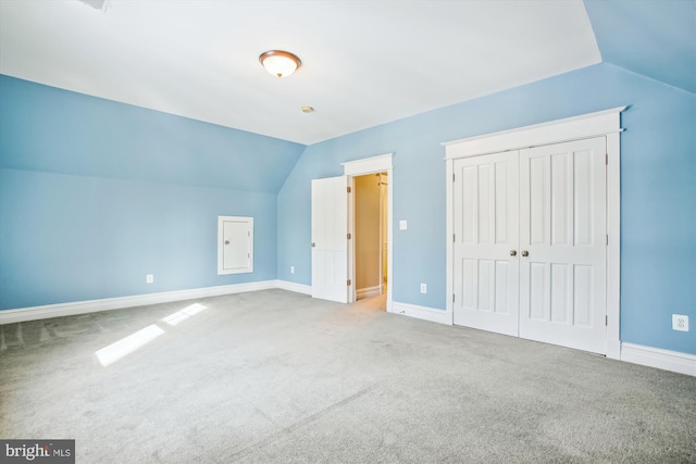 bonus room with carpet flooring and lofted ceiling