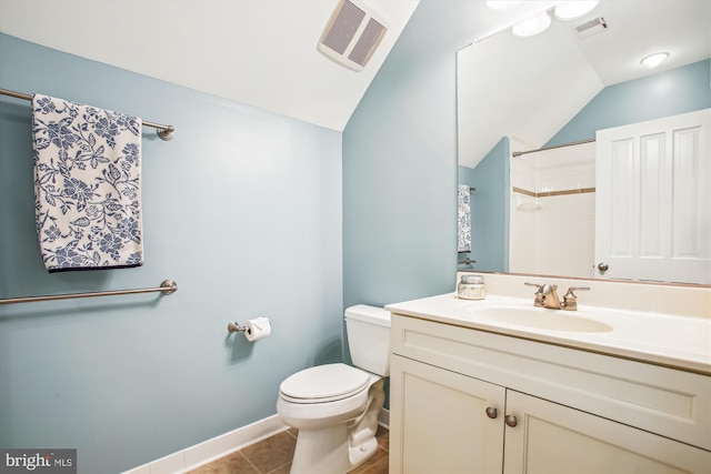 bathroom with walk in shower, tile patterned flooring, lofted ceiling, toilet, and vanity