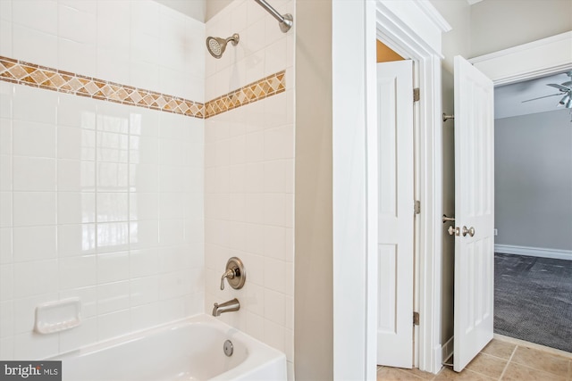 bathroom with tile patterned flooring and tiled shower / bath combo