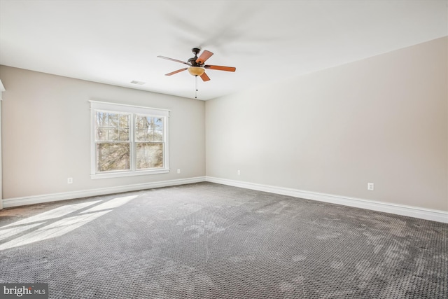 unfurnished room with ceiling fan and carpet floors