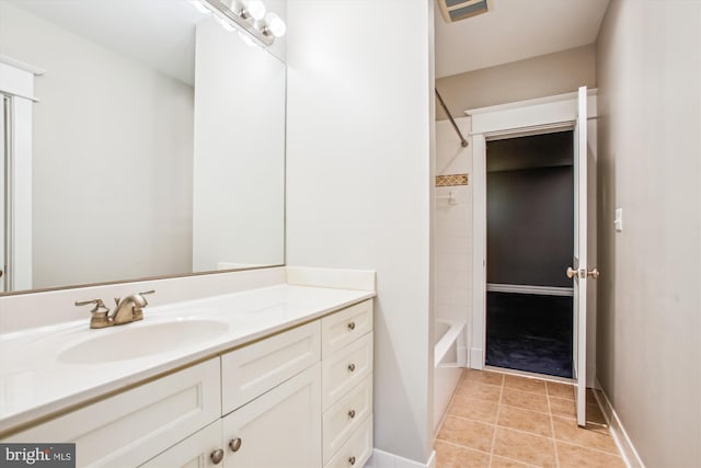 bathroom with vanity, shower / bath combination, and tile patterned floors