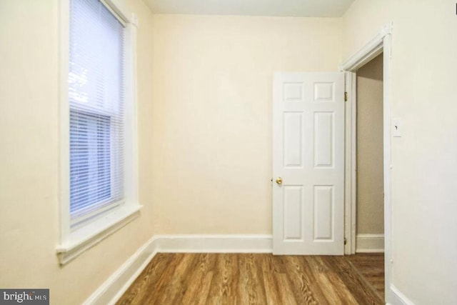 spare room with dark wood-type flooring