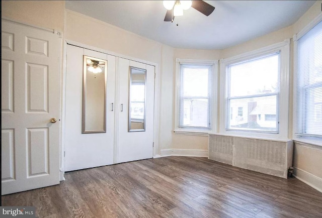 interior space featuring ceiling fan, french doors, and hardwood / wood-style flooring