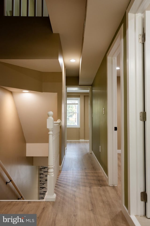 hall with light hardwood / wood-style flooring