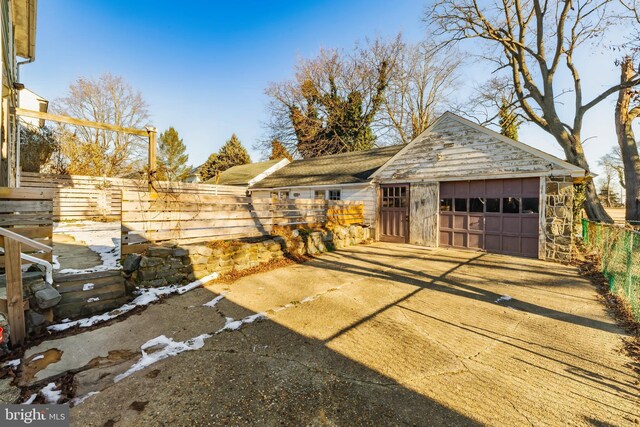 exterior space featuring an outbuilding and a garage