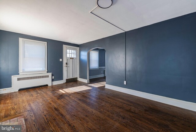 entryway featuring radiator and dark hardwood / wood-style flooring