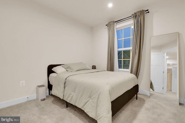 bedroom with light colored carpet