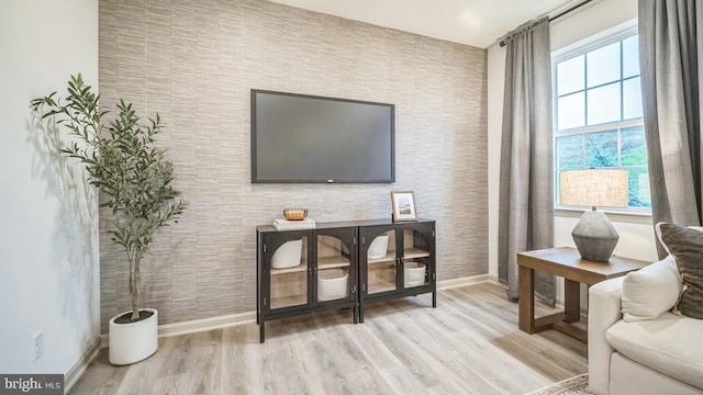 sitting room with light hardwood / wood-style flooring