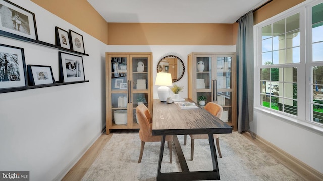 office area with plenty of natural light and light hardwood / wood-style floors