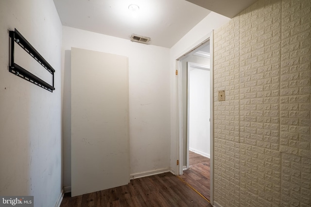 hall featuring dark wood-type flooring