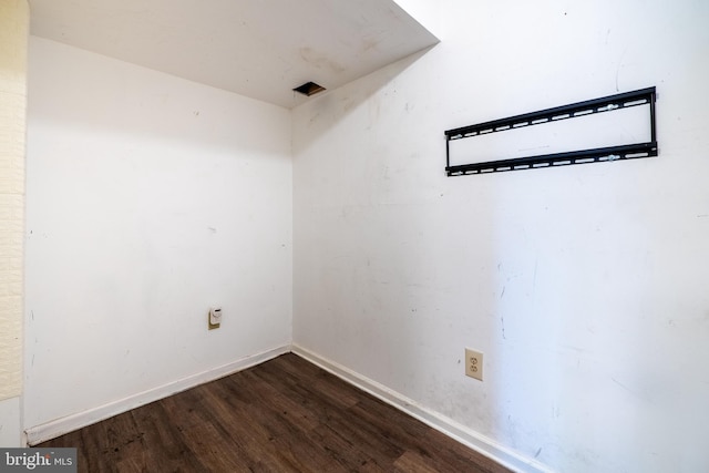 empty room featuring dark hardwood / wood-style flooring