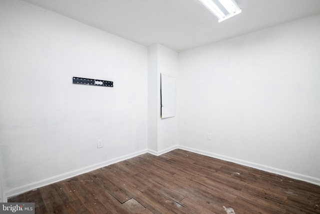 empty room featuring dark hardwood / wood-style floors