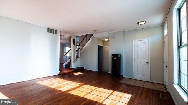 unfurnished living room with wood-type flooring