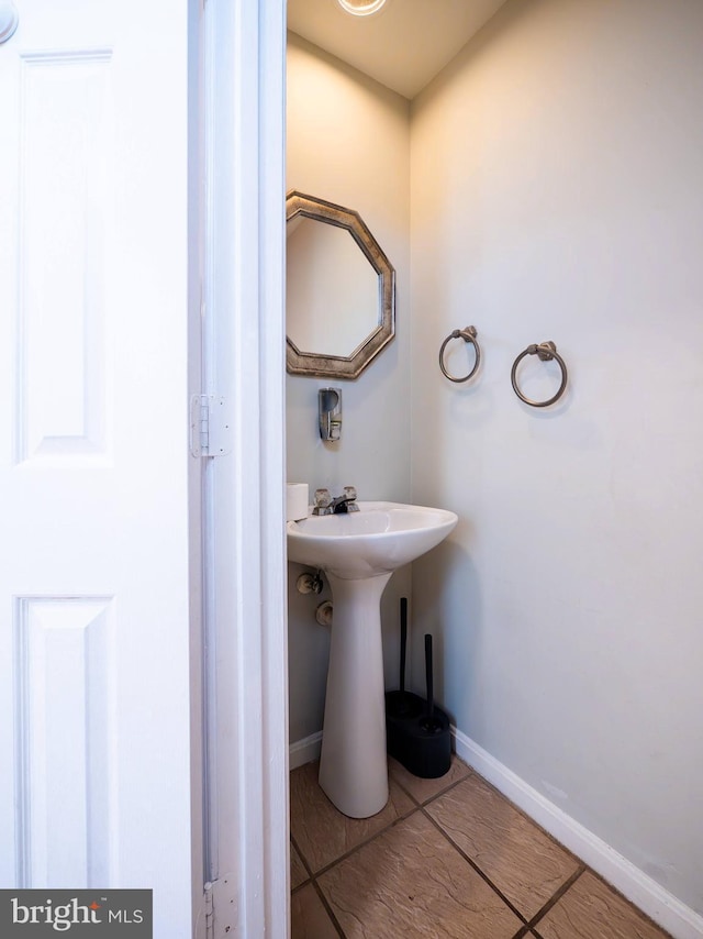 bathroom with tile patterned floors