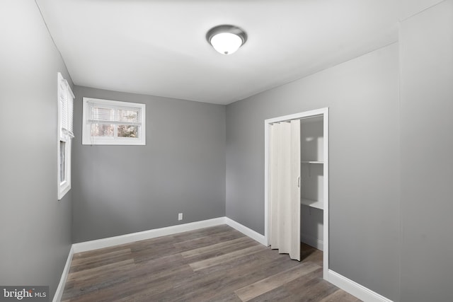 spare room featuring wood-type flooring