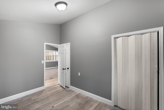 spare room featuring light hardwood / wood-style flooring