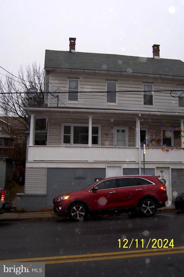 303 W Patterson St, Lansford, PA 18232 - view of front facade featuring a chimney