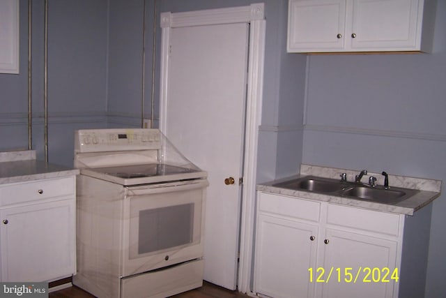 303 W Patterson St, Lansford, PA 18232 - kitchen featuring white range with electric stovetop, white cabinets, and light countertops