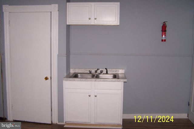 bathroom with sink and hardwood / wood-style flooring