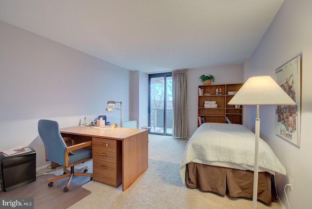 carpeted bedroom featuring access to outside