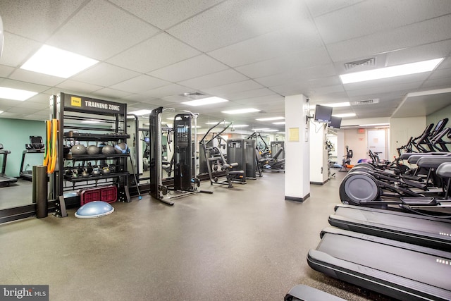 exercise room with a drop ceiling