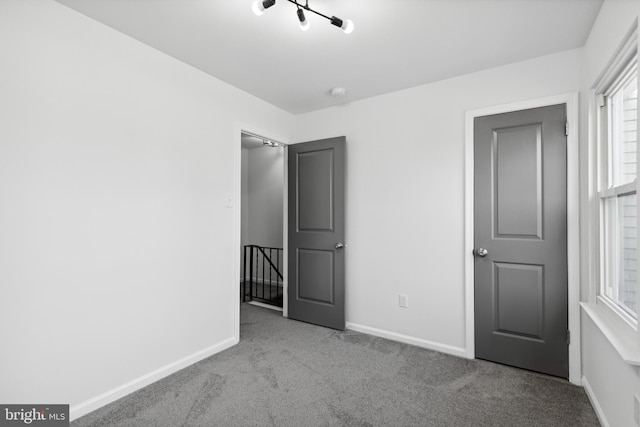 unfurnished bedroom with light carpet