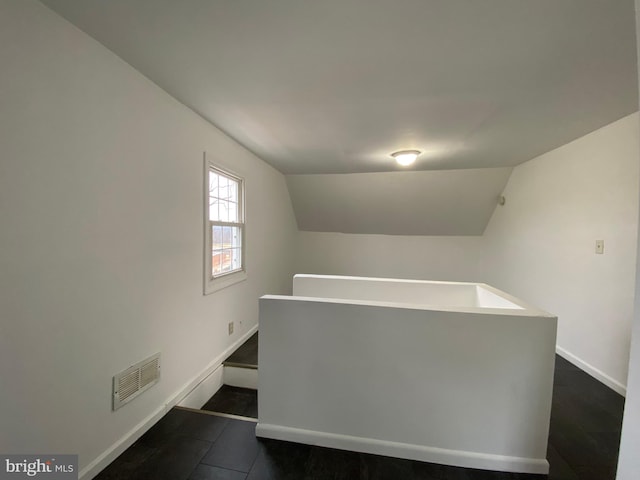 interior space featuring vaulted ceiling