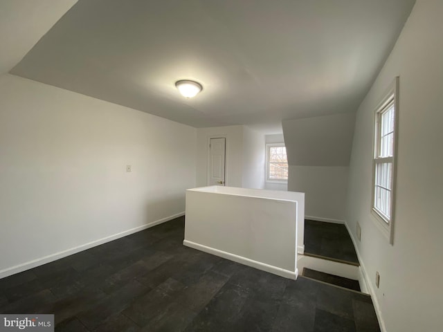 bonus room featuring dark hardwood / wood-style flooring