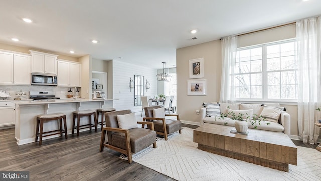 living room with dark hardwood / wood-style flooring