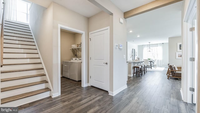 interior space with washing machine and dryer and wood-type flooring