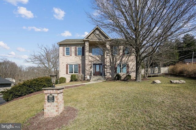 view of front facade featuring a front yard and a trampoline